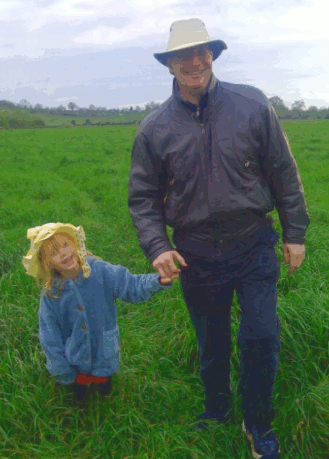 Shepherd with hat and little girl